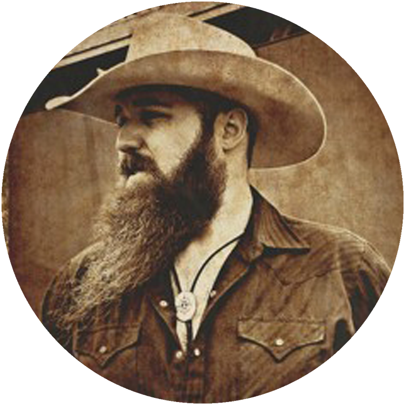 A sepia toned image of Brett Lowry in a western styled hat