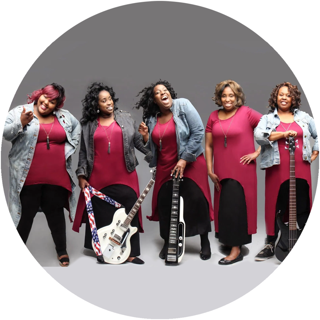 Nikki D and the Sisters of Thunder posing with their instruments